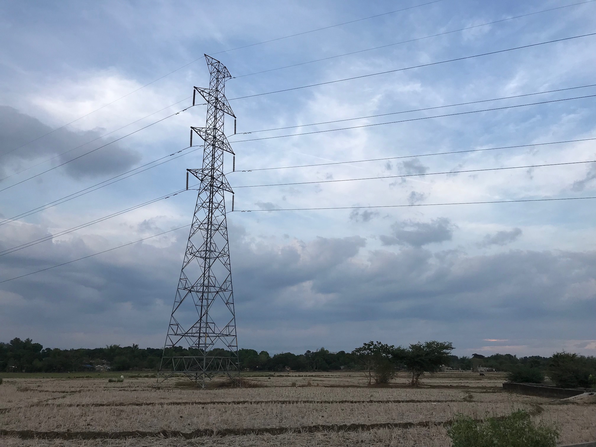 Electric tower, the field, and the sky