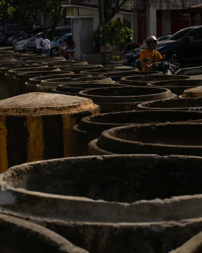 Concrete barrels on road