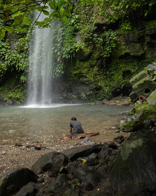 Woman in front of falls