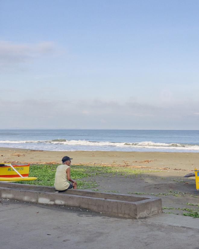 A lonely old man on a beach