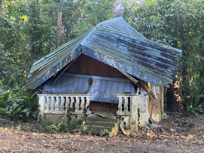 A blue dilapidated building