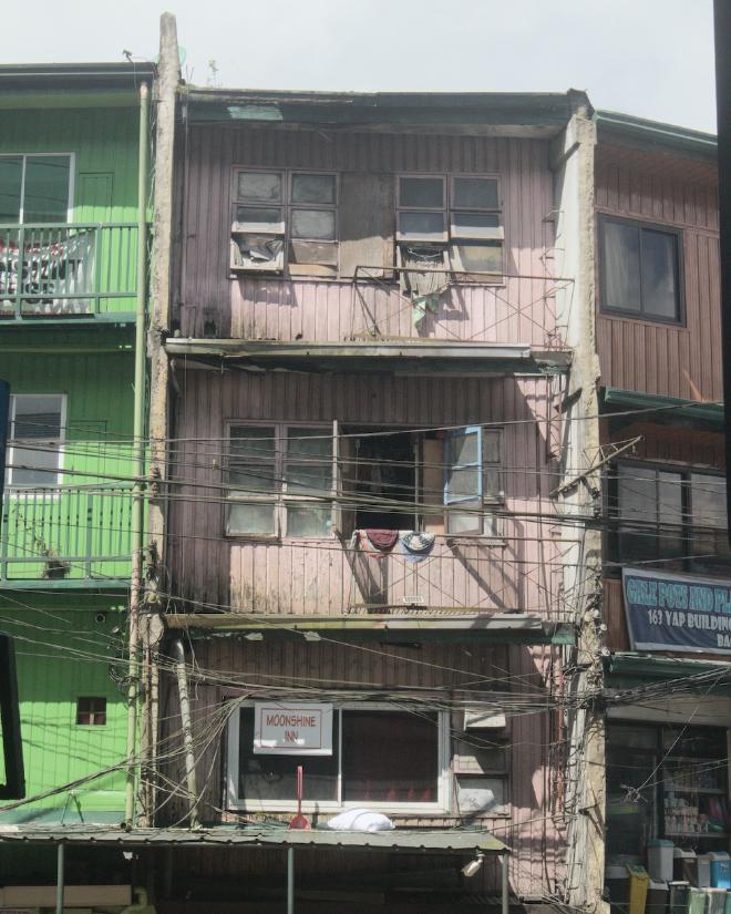 A dilapidated multi-color building